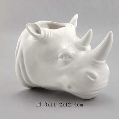 white ceramic wall planter