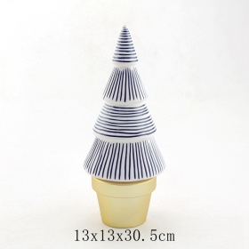 White christmas tree with blue lines and gold base